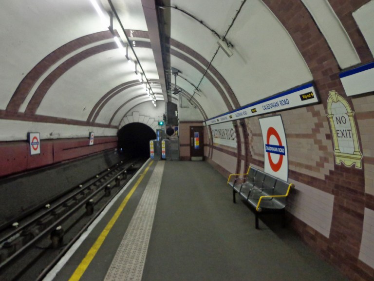 Caledonian Road station, London, UK. The station's tiles are based around salmon pink and dark pink, while the unique tiling pattern is a pair of lozenges. By diamond geezer [CC BY] via this flickr page