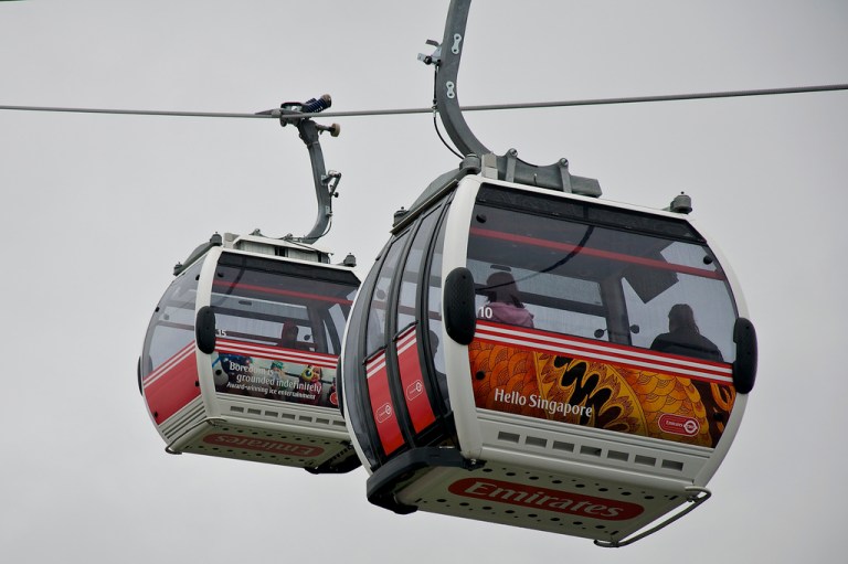 Cabins on the Emirates Air Line, with vinyls illustrating destinations served by the sponsor. By Martin Pettitt [CC 2.0] via this flickr page