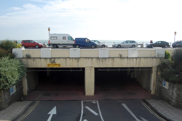 The parapet wall over the entrance to Carlisle Parade underground car park, September 2013. Today it shows signs of neglect. By Daniel Wright [CC BY-NC-ND 2.0] via this flickr set