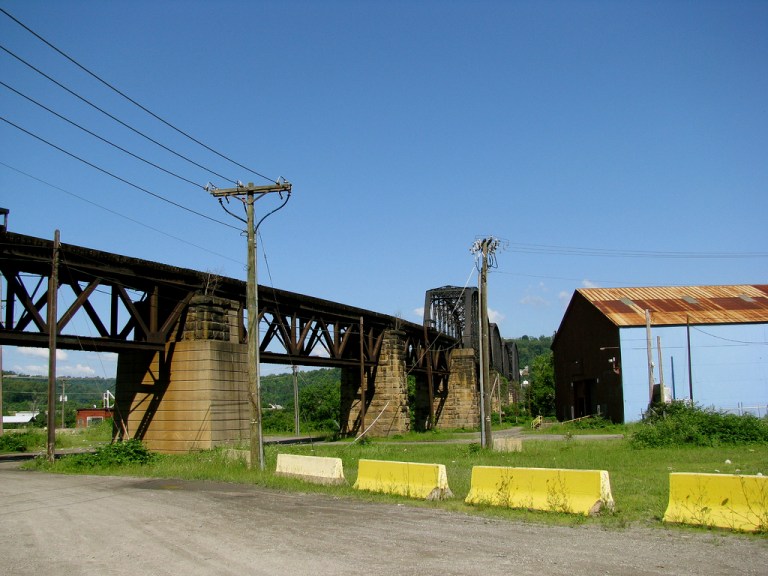 The railroad bridge and viaduct, curving away to the left in the foreground, are actually in Bellaire, Ohio. Photo by Ryan Stanton [CC BY 2.0] via this flickr page