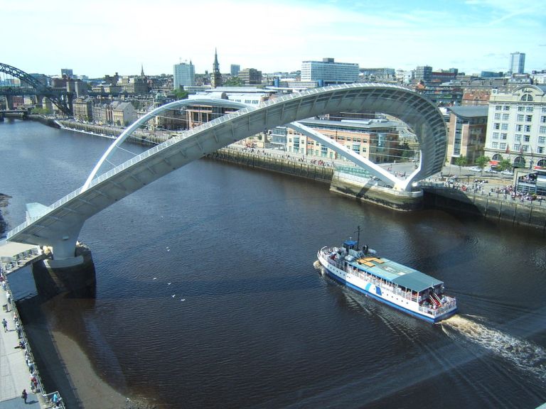 Boat passing under the raised Gateshead Millennium Bridge. Barbara Carr [CC-BY-SA-2.0], via Wikimedia Commons