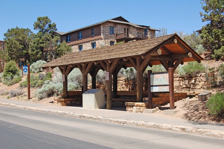Bus shelter opposite Grand Canyon train depot. The branching supports made of logs echo those on the train depot. Photo by Daniel Wright [CC BY-NC-ND 2.0] via this flickr set