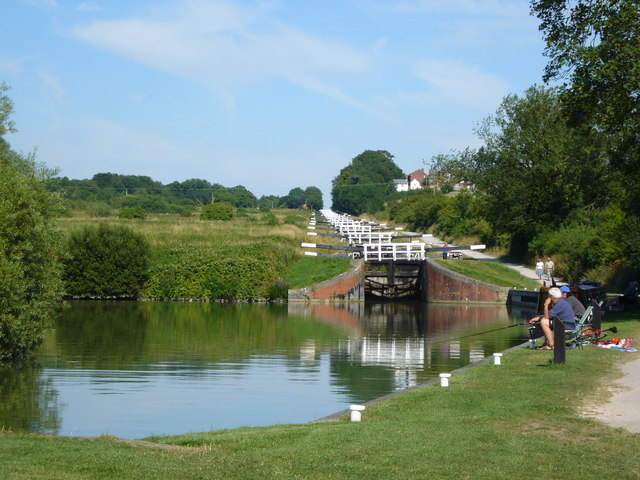 How idyllic is this? Wouldn't you agree that this piece of British countryside has been substantiially enhanced by this piece of transport infrastrucutre, the Caen Locks on the Kennet & Avon Canal in . Photo by Simon Scurr [CC BY-SA 2.0], via Wikimedia Commons