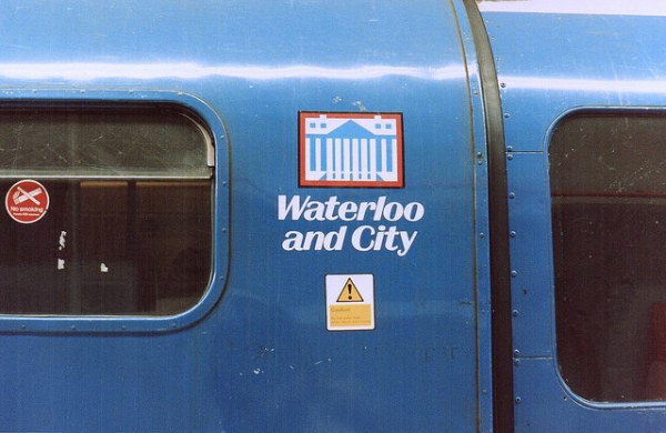 Waterloo and City route badge. The design is a representation of the Bank of England building, on top of Bank station, the Waterloo and City's northern terminus. Photo by Daniel Wright [CC BYNC-ND 2.0] via this flickr page