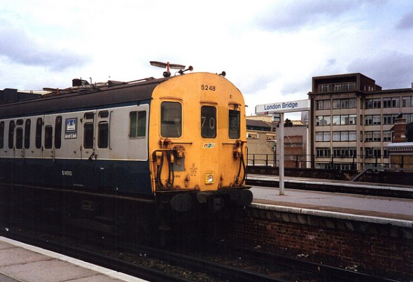 Kent Link route branding on a Class 415 train at London Bridge station. The Kent Link badge was a stylised representation of Christopher Wren's Greenwich Hospital. Photo by Paul Wright [CC BY-NC-ND 2.0] via this flickr page