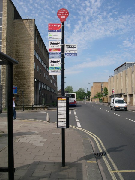 Bus stop in Oxford city centre, taken sometime between 2002 and 2006 while I was with Surrey County Council visiting colleagues in Oxfordshire County Council. Since then, Oxfordshire County Council has taken on responsibility for bus stop infrastructure and has replaced signs like this with something better designed.