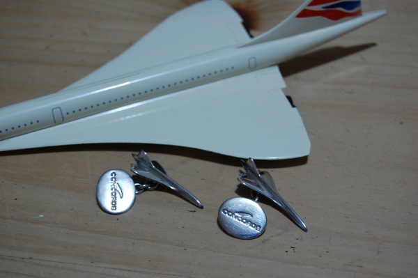 A pair of Concorde cufflinks, with a model Concorde behind. You used to be able to buy these from British Airways travel shops. Photo by Daniel Wright