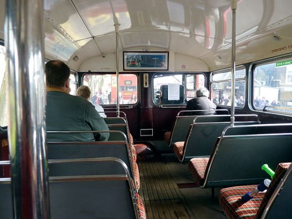 The cramped interior of a Routemaster's lower deck. Imagine trying to navigate it in a wheelchair. Photo by Linda Hartley from London, UK (Routemaster on the 101 route) [CC BY 2.0], via Wikimedia Commons