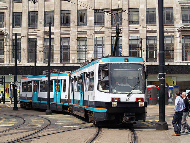 Manchester Metrolink tram in Manchester city centre. Photo by By David Ingham (originally posted to Flickr as P7257701) [CC BY-SA 2.0], via Wikimedia Commons
